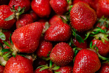 delicious strawberries in a yellow bowl on the table