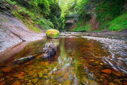 Finnich Glen.The Devil&rsquo;s Pulpit in Scotland. UK. Steep glen from the red sandstone by the Carnock Burn. Circular rock known as the Devil's Pulpit and a steep staircase known as the Devil's Steps 