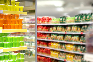 Choosing food from shelf in supermarket,vegetables in grocery section,Grocery stores