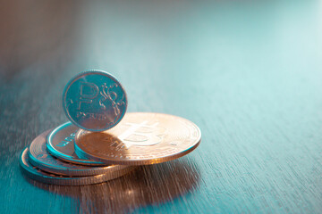 The ruble coin lies on bitcoin. The concept of buying cryptocurrency for rubles. High quality photo