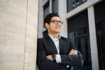 A financier with glasses a banker a man in a formal suit a businessman goes to work in the office