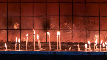 candles burning inside the church. christian ceremony. Close up