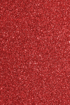 glittered background with many bright red reflections usable as a backdrop for the concepts of passion love feeling but also Christmas holidays