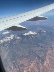 Fototapeta na wymiar Plane over the mountains in Colorado, USA