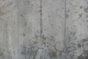 Reinforced concrete texture with areas covered with small cracks and spots. Surface of old and...