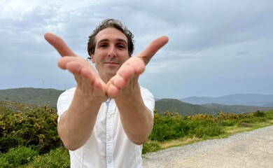 man with funny face He brought his hands to his face and smiled against the backdrop of the...