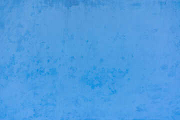 Fototapeta na wymiar Photo of the light blue colored rough stucco wall texture