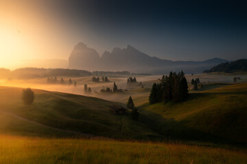 Misty sunrise in the Dolomites mountains on a summer morning
 - obrazy, fototapety, plakaty
