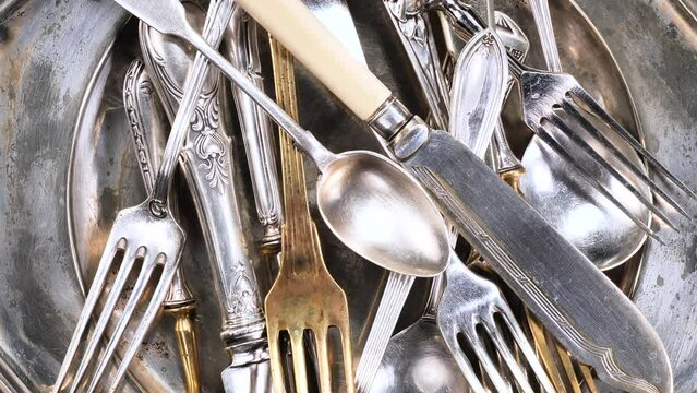 Silver old crockery on old background