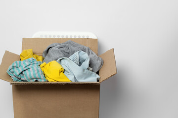 Donation clothes box on a white background. Charity concept. Waste recycling.