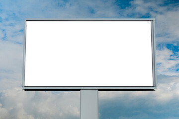 Front view: blank white billboard or large display against blue sky with white clouds - mock up. White screen, consumerism, advertising, template, copy space and mockup concept