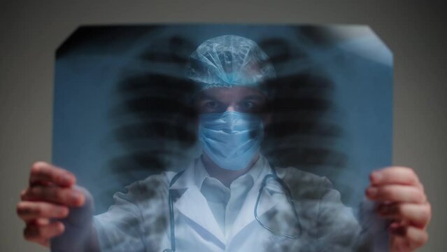 Healthcare and medicine. Doctor examining lungs x-ray close-up. Male nurse looking at ribs roentgen, human chest, checkup