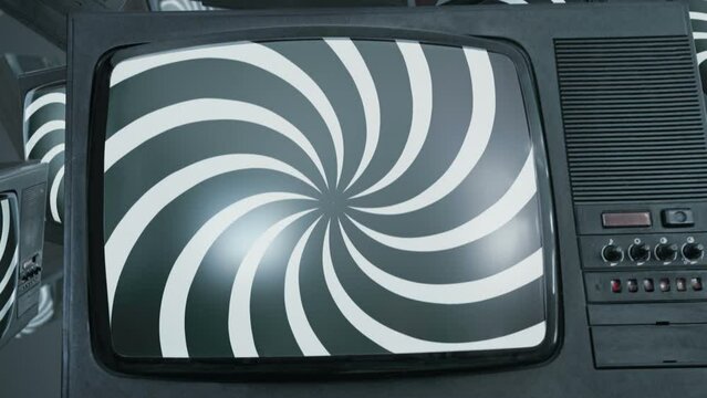 Hypnotic spiral on TV screens. Concept of influence of media on people. Broadcast, false information, hoax, propaganda, brainwashing, information and disinformation concept.