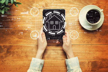 Real estate theme with a person holding a tablet computer