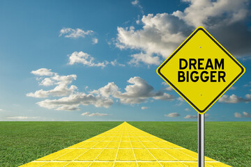 Dream Bigger motivation message on sign.