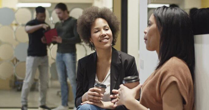 Black women talking during coffee break