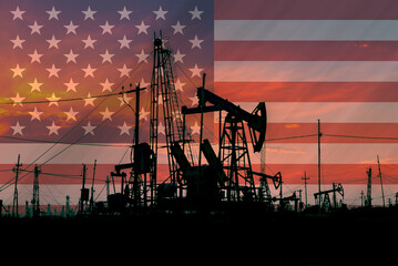 American flag in background of oil wells and rigs