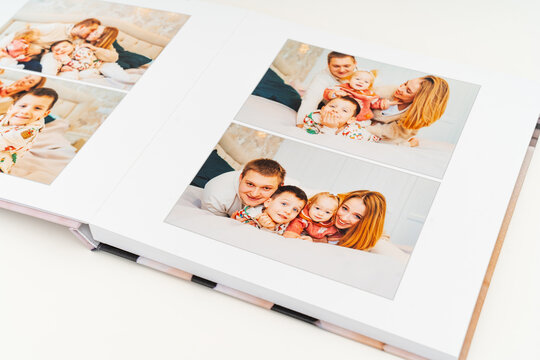 a book with photos of family at home on a white background.