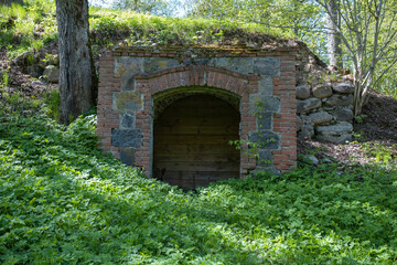 old castle stone underground cellar. wooden board wall, entrance