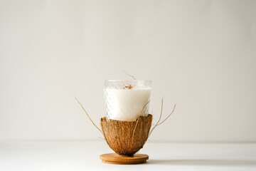 Handmade scented candles in a glass with a wooden lid. Coconut candle. Candles for the house. candle on white background