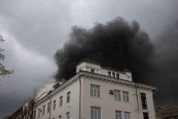 Kharkiv building with smoke from explosion caused by a Russian missile in