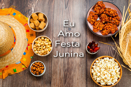 Typical Brazilian junina party sweets - Written "I love June party" in Portuguese. Top view