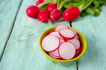 fresh radish isolated on wooden background