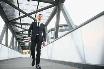 Portrait of an handsome businessman in an urban setting