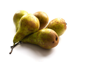 Five conference pears on a white isolated background