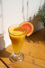 glass of orange juice on table