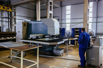 CNC punching and perforation machine and perforated steel sheet
