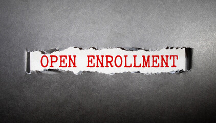 Torn paper with OPEN ENROLLMENT in opening background