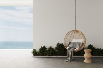 Rattan lounge hanging chairs with pillow and plaid in a white room with concrete floor,coffe table, decor and plants with sea view. 3d render. Mockup frame for presentation