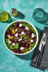 salad with beets, arugula and farm sheep's cheese with nuts and balsamic sauce. summer recipe