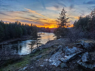 sunset on the rocks overlooking river