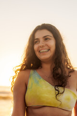 Young hispanic beautiful woman smiling at the beach