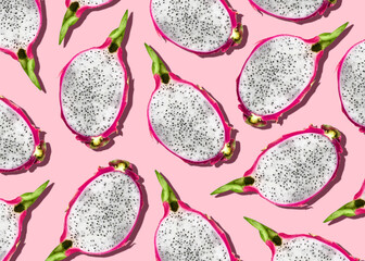 Pitahaya. Top view photo pattern. Cutted fresh dragon fruits on pink background