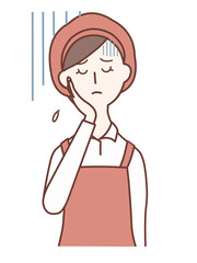 Depressed female clerk with her hand on her cheek