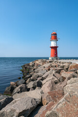 Fototapeta na wymiar Lighthouse Ostmole Warnemünde in summer, Rostock, Mecklenburg-Vorpommern, Germany
