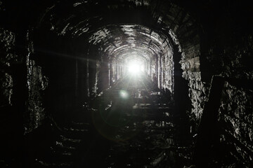 Dark abandoned mine in backlight