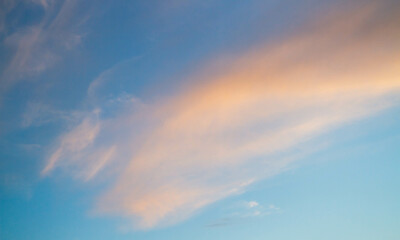 Naklejka na ściany i meble Summer sky. Cumulus clouds on a blue background. Partly cloudy.