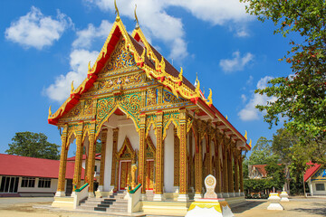 Thai buddhist temple in Phuket, Thailand. Blue sky, copy space for text, wallpaper