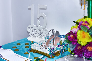 shoes and crown of 15 years on the decorated table