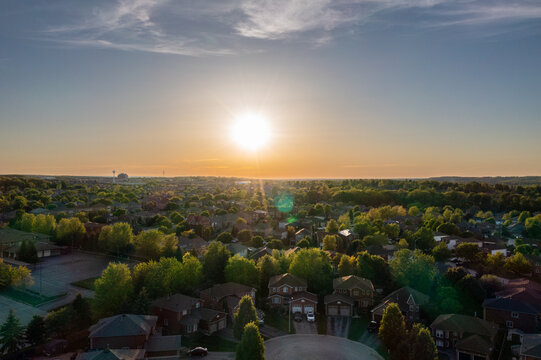 Barrie at sunset houses and views of lake Simco in the summertime - Powered by Adobe