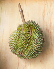 Fresh durian on wooden plank background - 506540611