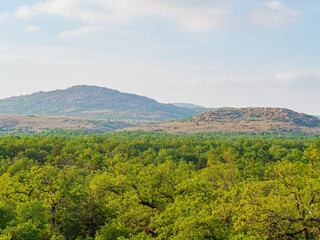 Fototapeta premium Sunny view of the landscape around Wichita Mountains Wildlife Refuge