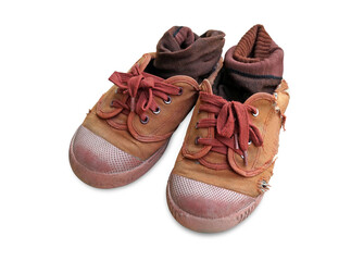 old and dirty brown canvas students shoes on white background