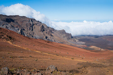 hiking trail through sandy slopes and mountains at edge of haleakala crater maui hawaii