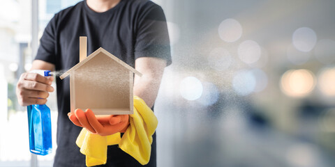 The cleaning service surface sanitizing against COVID-19 outbreak Close up view of man clean home using spray cleaning  House keeping maid cleaning service  coronavirus wearing nitrile glove.