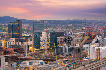 Fototapeta na wymiar Oslo waterfront downtown city skyline cityscape in Norway at sunset